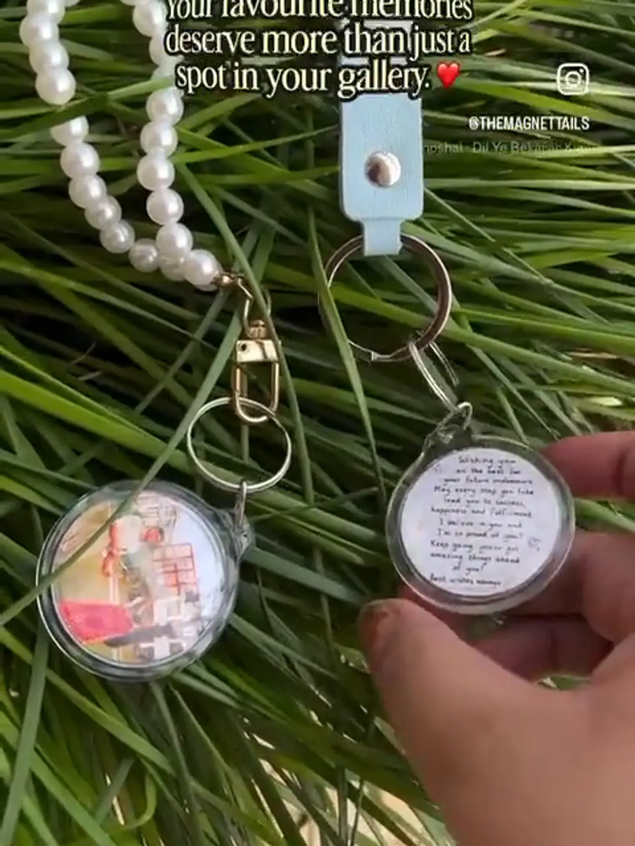 A finished photo keychain and a beaded wristlet held up at the stall